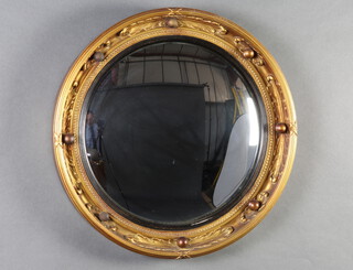 A Georgian style convex plate wall mirror contained in a gilt ball studded frame 46cm diam. 