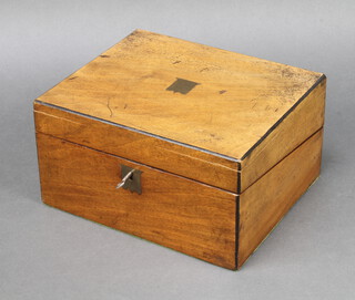 A Victorian bleached mahogany writing slope with hinged lid, fitted an inkwell 13cm h x 26cm w x 21cm d, complete with key 
