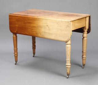 A Victorian bleached mahogany Pembroke table fitted a frieze drawer, raised on turned supports ending in brass caps and castors 68cm h x 91cm w x 46cm when closed x 92cm when open 