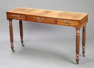 A William IV bleached mahogany reading table fitted a rectangular adjustable ratchet top, 1 long drawer flanked by a pair of dummy drawers, raised on spiral turned supports, brass caps and castors 75cm h x 131cm w x 41cm d (possibly made-up) 