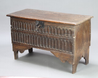 A 17th/18th Century carved oak coffer of panelled construction, interior fitted a candle box and with lock, having arcaded decoration to the front 59cm h x 99cm w x 41cm d 
