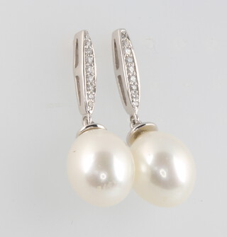 A pair of 9ct white gold cultured pearl and diamond drop earrings, 4 grams, 25mm 