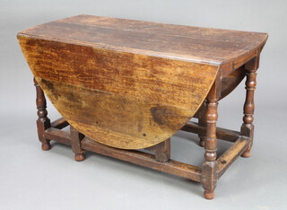 A Victorian, oak 17th Century style oval drop flap gateleg dining table raised on turned and block supports with box framed stretcher 70cm h x 138cm w x 61cm when closed 
