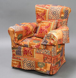 A Victorian armchair with elephant pattern loose cover 82cm h x 60cm w x 72cm d (inside seat measurement 42cm w x 51cm d) 