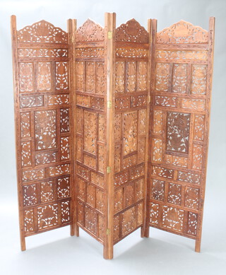 An Indian pierced and carved hardwood 4 fold screen 183cm h x 51cm w when closed x 200cm when open 