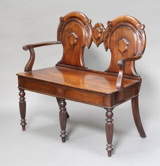 A 19th Century style mahogany double chair back settee formed from 2 hall chairs, the base fitted 2 secret drawers, raised on turned and reeded supports 88cm h x 92cm w x 41cm w, inside seat measurement 84cm w x 39cm d 