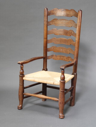 A 18th Century elm Lancashire ladder back chair with woven rush seat