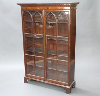 A Georgian mahogany bookcase with moulded and dentil cornice, fitted adjustable shelves enclosed by astragal glazed panelled doors, raised on bracket feet 154cm h x 103cm w x 33cm d (formerly the top of a bureau bookcase) 