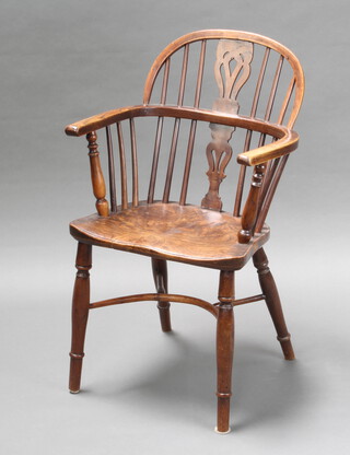 A 19th Century elm and yew Windsor stick back carver chair with pierced vase shaped slat back and solid elm seat, raised on turned supports with crinoline stretcher 80cm h x 49cm w x 40cm d (inside seat 35cm w x 34cm d)