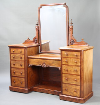 A Victorian bleached mahogany inverted break front dressing table with rectangular plate mirror to the centre above 1 long drawer and recess flanked by 10 short drawers with tore handles 170cm h x 174cm w x 90cm d 