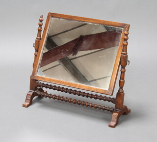 An 18th Century style rectangular plate dressing table mirror contained in an oak frame with ring turned decoration 54cm h x 57cm w x 24cm d 