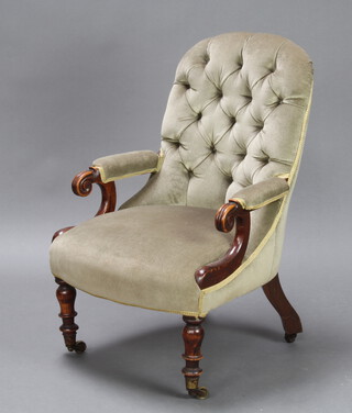 A Victorian mahogany show frame open arm chair upholstered in green buttoned material 93cm h x 58cm w x 65cm d (inside seat measurement 51cm w x 52cm d) 