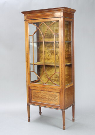 An Edwardian inlaid mahogany display cabinet with moulded cornice, interior fitted plush shelves enclosed by astragal glazed panelled doors, the base enclosed by a fall front panelled door, raised on square tapered supports 170cm h x 73cm w x 40cm d