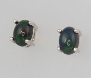A pair of silver oval black Ethiopian opal ear studs 