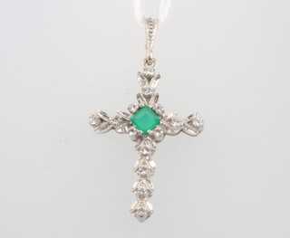 A white gold diamond and emerald set cross pendant 3.5cm, 2.7 grams 