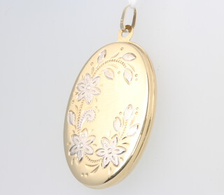 A 9ct yellow gold 2 colour oval locket 38mm, gross 4.5 grams 