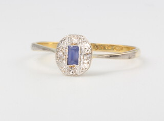 An 18ct yellow gold oval tanzanite and diamond cluster ring, 1.5 grams, size Q 