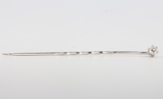 A white gold single stone diamond tie pin, approx. 0.10ct, 5.5cm
