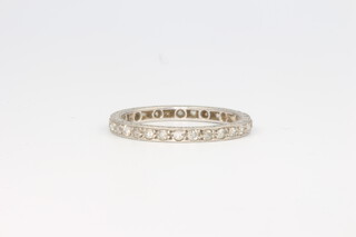 A white gold diamond set eternity ring 2.5 grams, size M 1/2