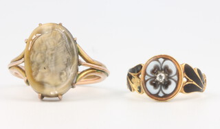 A 9ct yellow gold carved cameo ring 4.8 grams, size R together with an 18ct enamel diamond and harstone mourning ring 2.8 grams, size J 