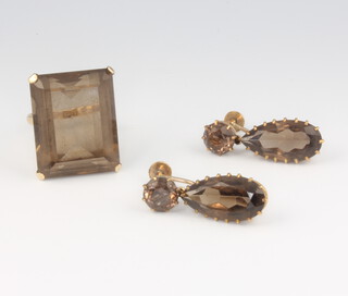 A lady's 9ct yellow gold smoky quartz dress ring 25mm x 20mm, size N together with a pair of pear cut ditto ear clips 