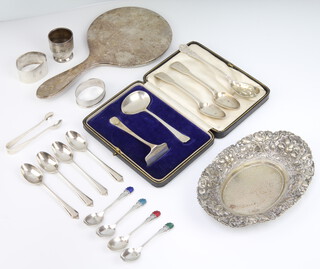 An 800 standard bowl 17cm, 115 grams and minor silver ware including serviette rings and spoons, 250 grams 