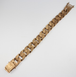 A gentleman's 9ct yellow gold bark finish bracelet, 215mm x 15mm w, 72 grams