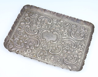 An Edwardian repousse silver rectangular dressing table tray decorated with flowers, Edinburgh 1900, maker Hamilton and Inches, 28cm, 376 grams  