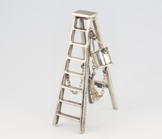 A Continental 925 silver model of a pair of folding step ladders with a paint pot and brush, 7.5cm, 35 grams 