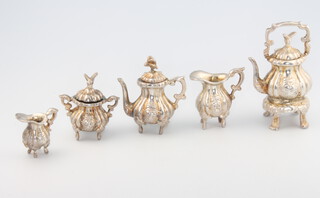 A Continental Rococo style silver miniature 5 piece tea set, 95 grams