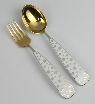 A Michelsen, a pair of silver gilt and enamel spoon and fork, 88 grams 

