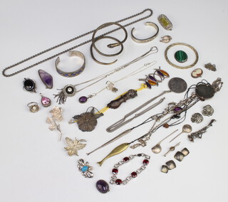 A silver bangle, other bangles, a cameo and other brooches and a quantity of silver jewellery etc