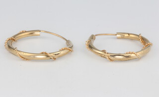 A pair of yellow gold hoop earrings 1.3 grams