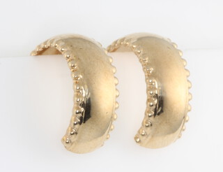 A pair of 9ct yellow gold half hoop earrings 1.4 grams