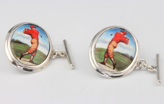 A pair of oval silver cufflinks decorated with golfers, 8.5 grams