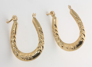 A pair of 9ct yellow gold hoop earrings 1.3 grams
