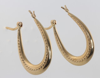 A pair of 9ct yellow gold oval hoop earrings 1.7 grams