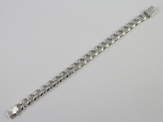 A silver curb link bracelet 64 grams 