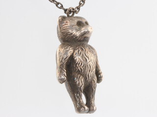 A silver bear pendant and chain 5 grams 