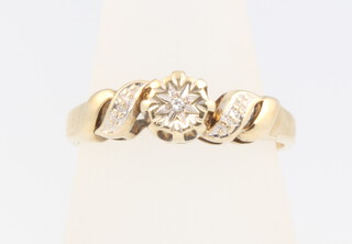 A 9ct yellow gold diamond ring, size K, 2.1 grams  