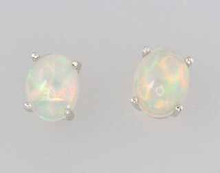 A pair of silver Ethiopian opal ear studs