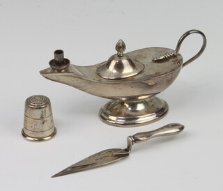 A sterling silver figure of a lamp together with a bookmark and thimble 39 grams