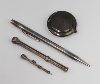 An Edwardian circular silver compact and 3 pencils 