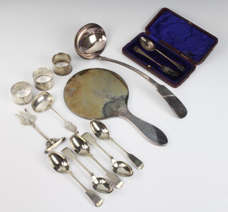 A silver cased christening set Sheffield 1911, napkin rings and minor cutlery, weighable silver 275 grams