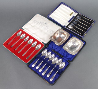 A set of cased silver teaspoons Birmingham 1911, 2 other cased sets, 220 grams together with 2 plated table salts 