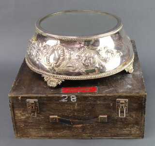 A silver plated circular repousse cake stand with mirrored top 38cm diam. contained in a pine box 