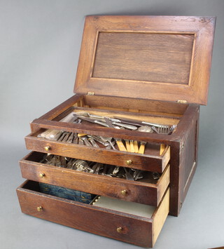 A 3 drawer oak canteen containing a quantity of plated cutlery 