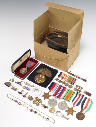 A grould of World War Two miniature medals comprising 1939-45, Africa Star with 8th Army Bar, Italy Star, Defence and War medal, 4 WWII medals, an Imperial Service medal and minor badges etc, together with a gas mask 