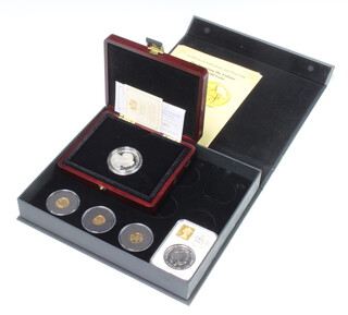 Three London Mint Office commemorative 9ct gold coins, each 1.2 grams, a Guernsey five pound silver commemorative crown 2013 and a 2012 silver Britannia crown 32.4 grams