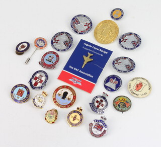 A collection of enamelled and other lapel badges and pins 
